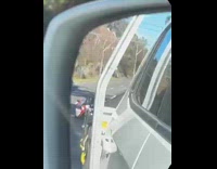 Race car tailing behind truck 