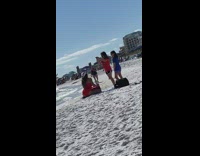 Woman red bikini white hat sit beach seaside photo shoot