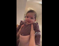 Baby girl being lifted smile at dad