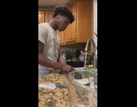 Guy on white headset doing dishes 