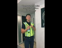 Guy fake police officer comes into house dances green safety vest 
