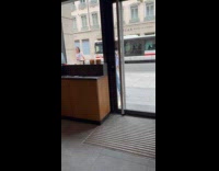 Collab IITW - Woman with headphones tiktok dance outside Starbucks