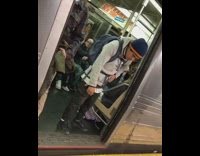 Guy sleeps standing up and gets head face stuck between closing doors on subway train