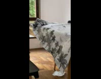 Cat pulls cloth off table trying to climb up 