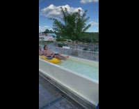 Guys on connected tube go down water slide pt. 2