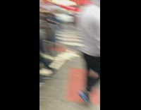 Giant ball of white yarn rolls across crosswalk in the rain