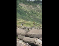 Girl leggings raise arm pose rocks mountain