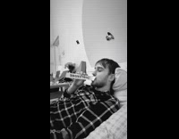 Guy blows into empty toblerone chocolate box 