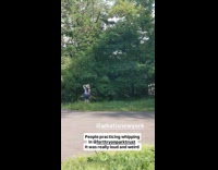 Man and woman practice whipping in park