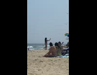 Woman bikini selfie on the beach commentated by filmer