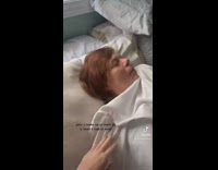 Girl wakes and startles sleeping mom