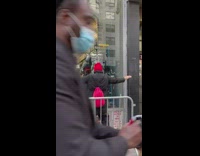 Guy does arm workout in front of Batman 