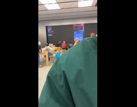 Boy raises hand on new phone demonstration