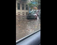 Submitter driving by flooded street 
