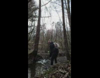 Man with a backpack golf at the forest in Slow Motion Part 1