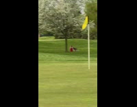 Girl red dress hair flip golf course