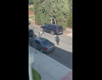 Woman checkered long sleeves hold vacuum cleaner street