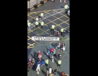 White banner says prince andrew is a nonce 