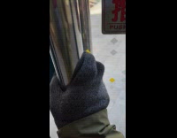 Guy show pushed sign on door glass