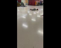 Woman grey pants lay twerk on floor