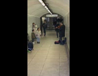 Kids watch violin player in awe 
