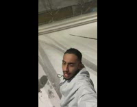 Man Shouts Outside and Shows Snow-Covered Cars