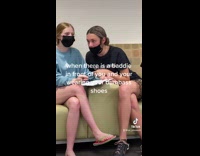 Guy wearing red fish slippers embarrassing