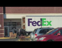 FedEx man throw boxes carelessly inside truck
