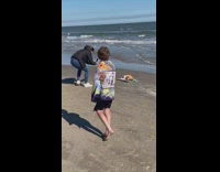 Mother lay sleeping baby on mat beach