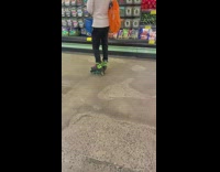 Person on roller skates in supermarket shopping