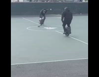 Guys play hockey while riding onewheels park