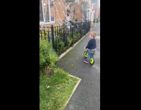 Boy rides bike happy to see decorations
