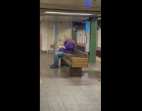 Guy sits under leaking water at station 