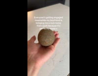 Woman show round rock that boyfriend gave