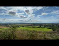 Time lapse green farm lands clouds windy
