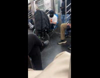 Guy rides subway sits on camping chair 