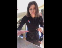 Girl disrespecting the red white and blue Dominos pizza uniform