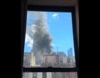 Large smoke from fire on building rooftop part 1