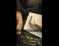 damn jania woman grading papers on the train