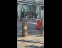 Guy maroon shirt stand beside james bond