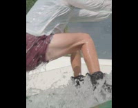 Guy rides wakeboard up ramp and does stunt 