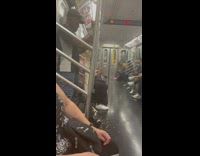 Man carves and shreds some wood inside the train