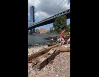 Woman wears gray dress pose for photo