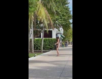 Girl wearing bikini and bucket hat dances