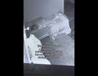 Child smile stare at corner security camera