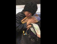 woman cuddles and caresses book