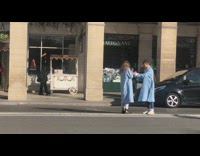 Two influencer blue coat argue on street