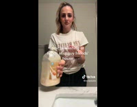 Lady Pours Liquid Hand Soap on Hand