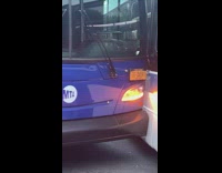 Two busses stopped on street after accident 
