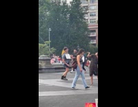 Guy twitches and falls on park ground 